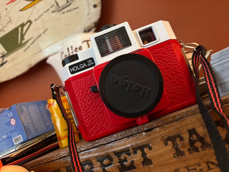 holga camera with film in the background
