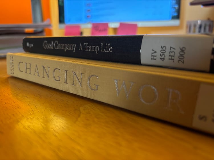 two library books by Douglas Harper on a desk with a computer monitor in the background