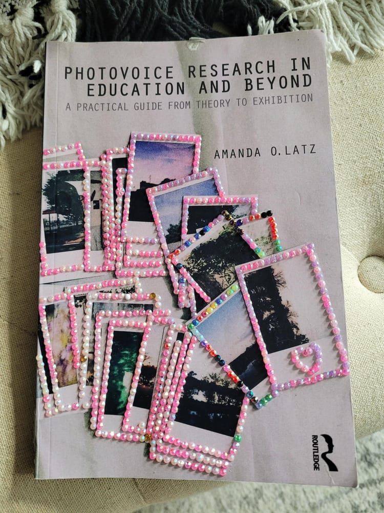 front cover of a book about photovoice with polaroid photographs on the front cover that have been bedazzled