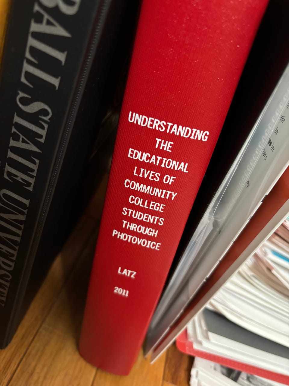 spine of my dissertation with the title: Understanding the Educational Lives of Community College Students through Photovoice