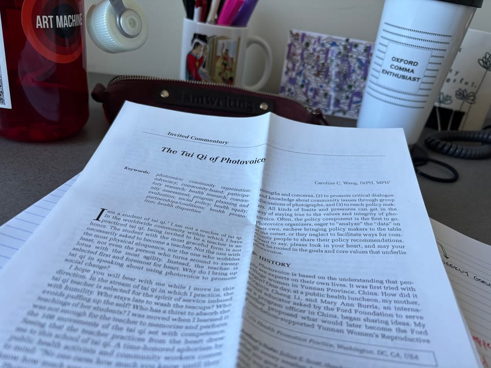 cover page of the article "The Tai Qi of Photovoice" atop a desk